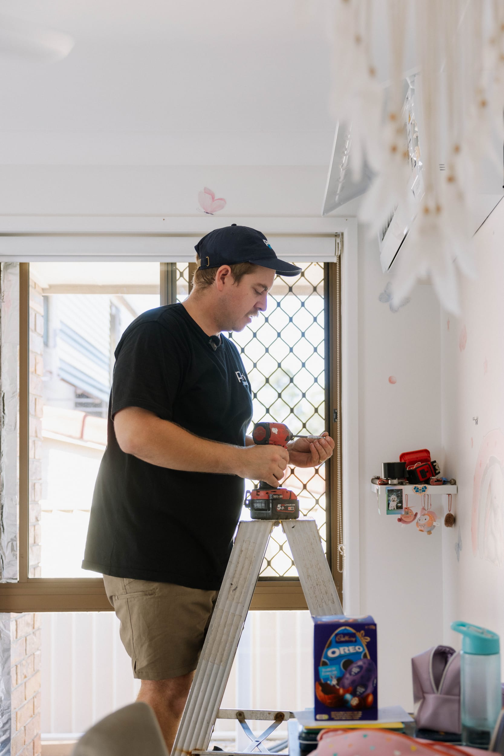 Mitsubishi Electric split system being installed in a McDowall bedroom