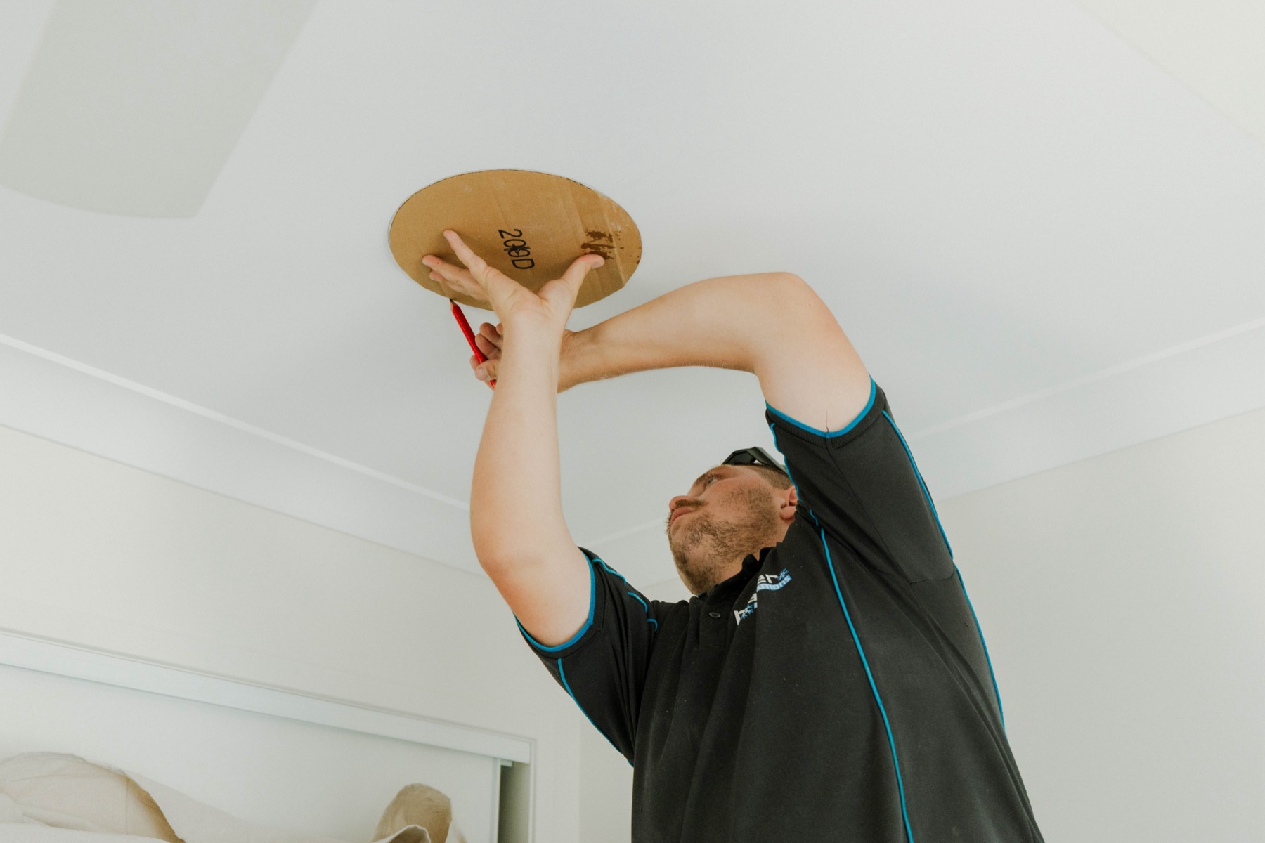 Measuring and marking ceiling cutout for a ducted air conditioning supply vent