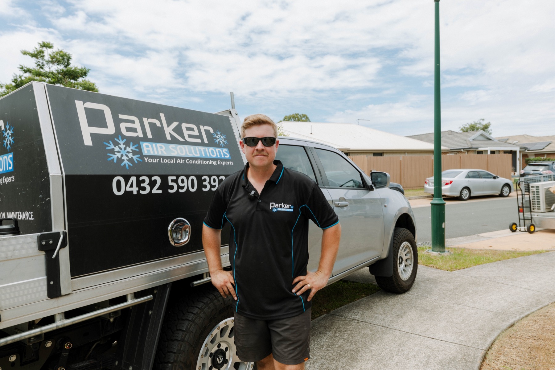 Parker Air Solutions branded ute arriving at a residential job in Brisbane Northside